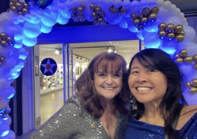 Rotarians at the balloon-arch entrance to the 2024 Foundation Dinner