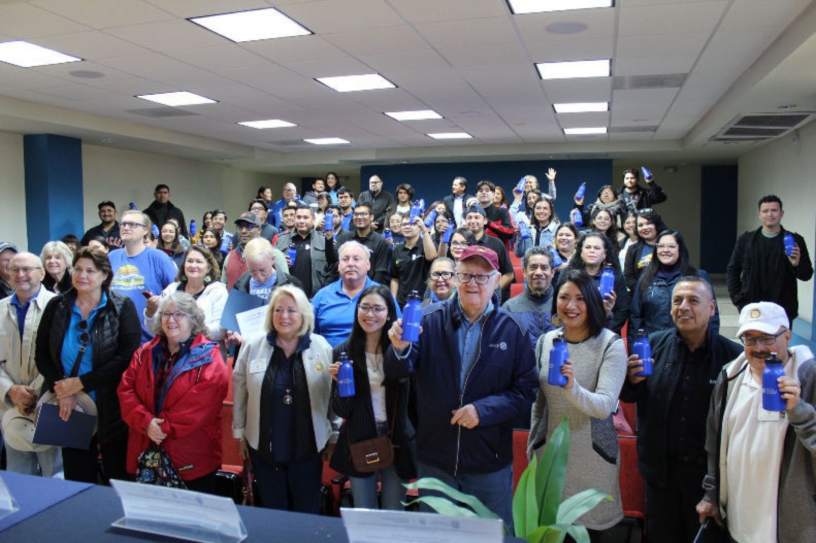 Rotarians and Mexicali Technology University students raising their new refillable water bottles