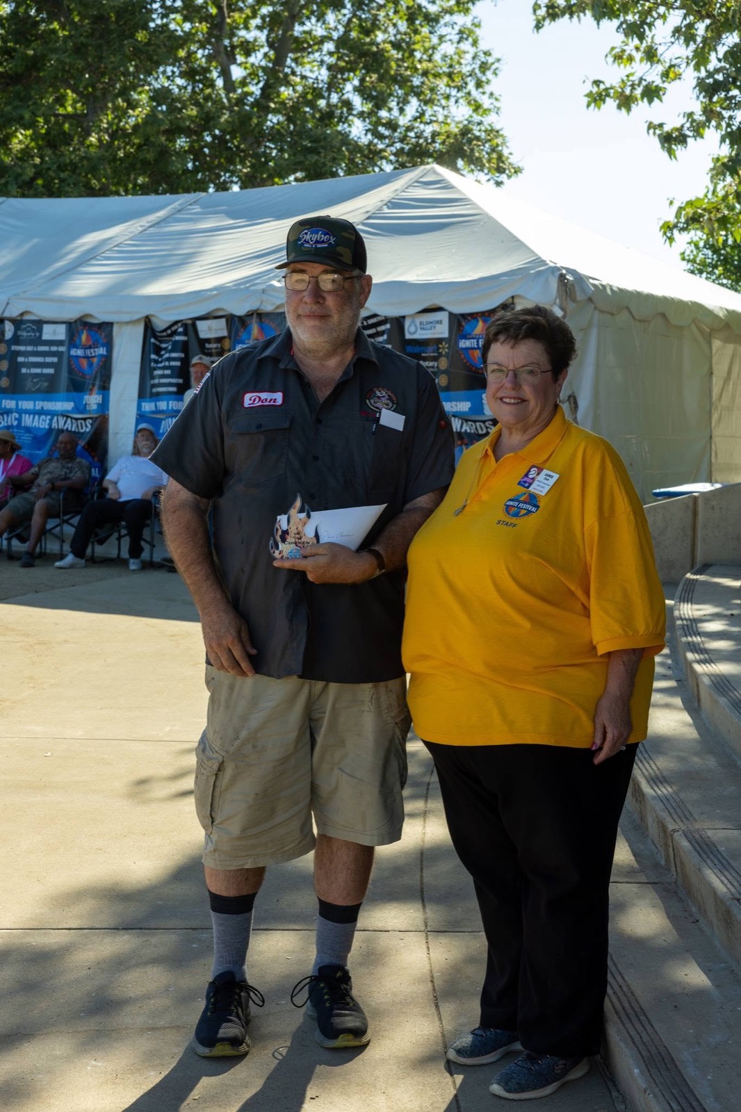 A BBQ competition team receives their award at the iGNITE Festival