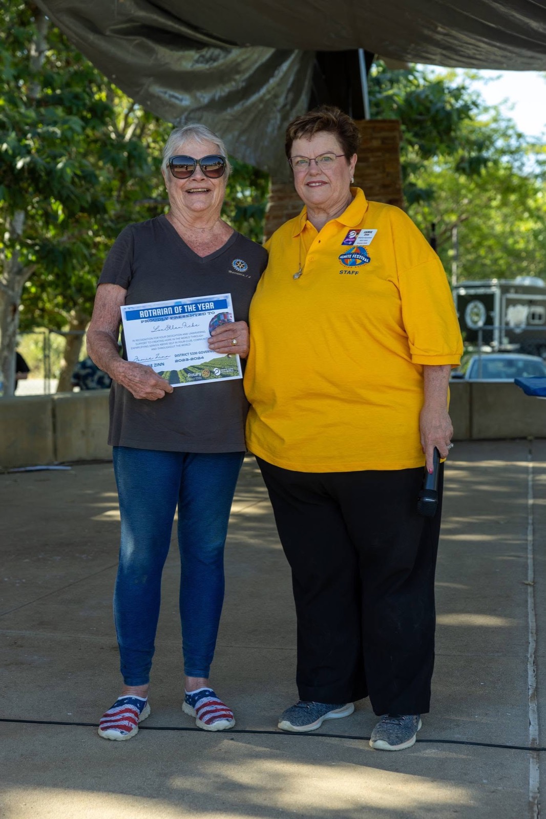 DG Jamie Zinn presents the Rotarian of the Year award at the iGNITE Festival
