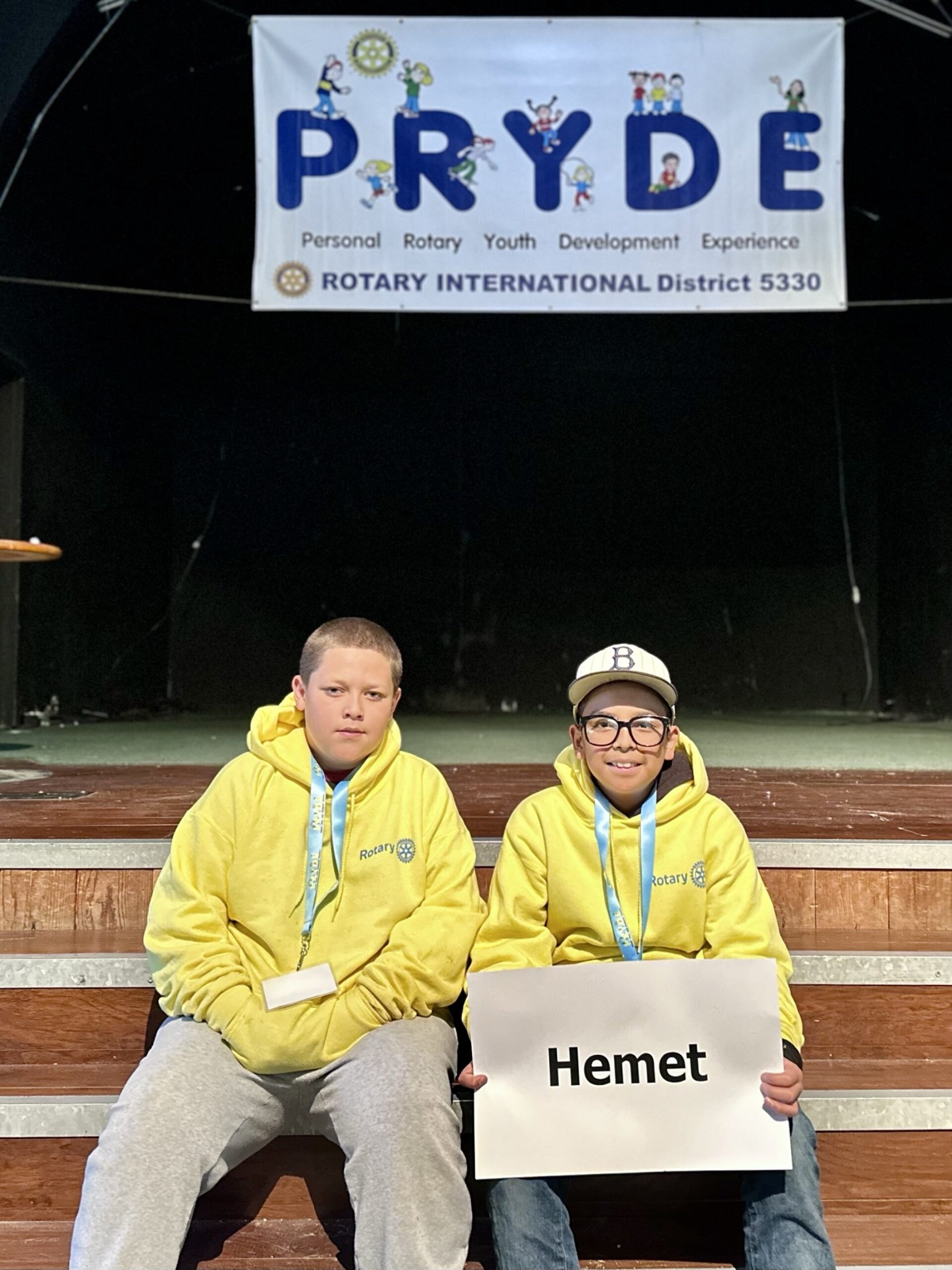 A sponsoring club's students at PRYDE 2023, under the PRYDE banner