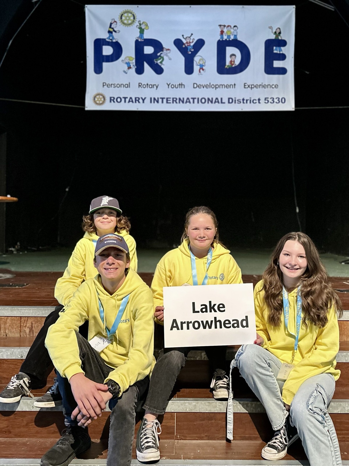A sponsoring club's students at PRYDE 2023, under the PRYDE banner