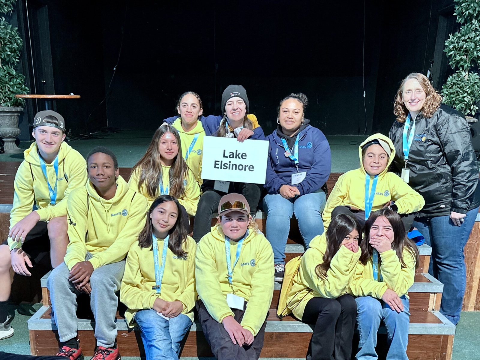 A sponsoring club's students at PRYDE 2023, under the PRYDE banner