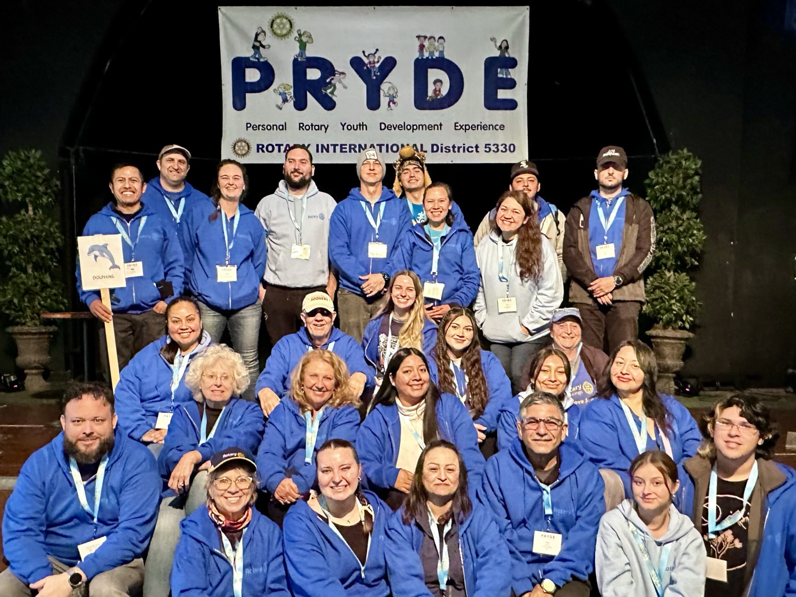 A sponsoring club's students at PRYDE 2023, under the PRYDE banner