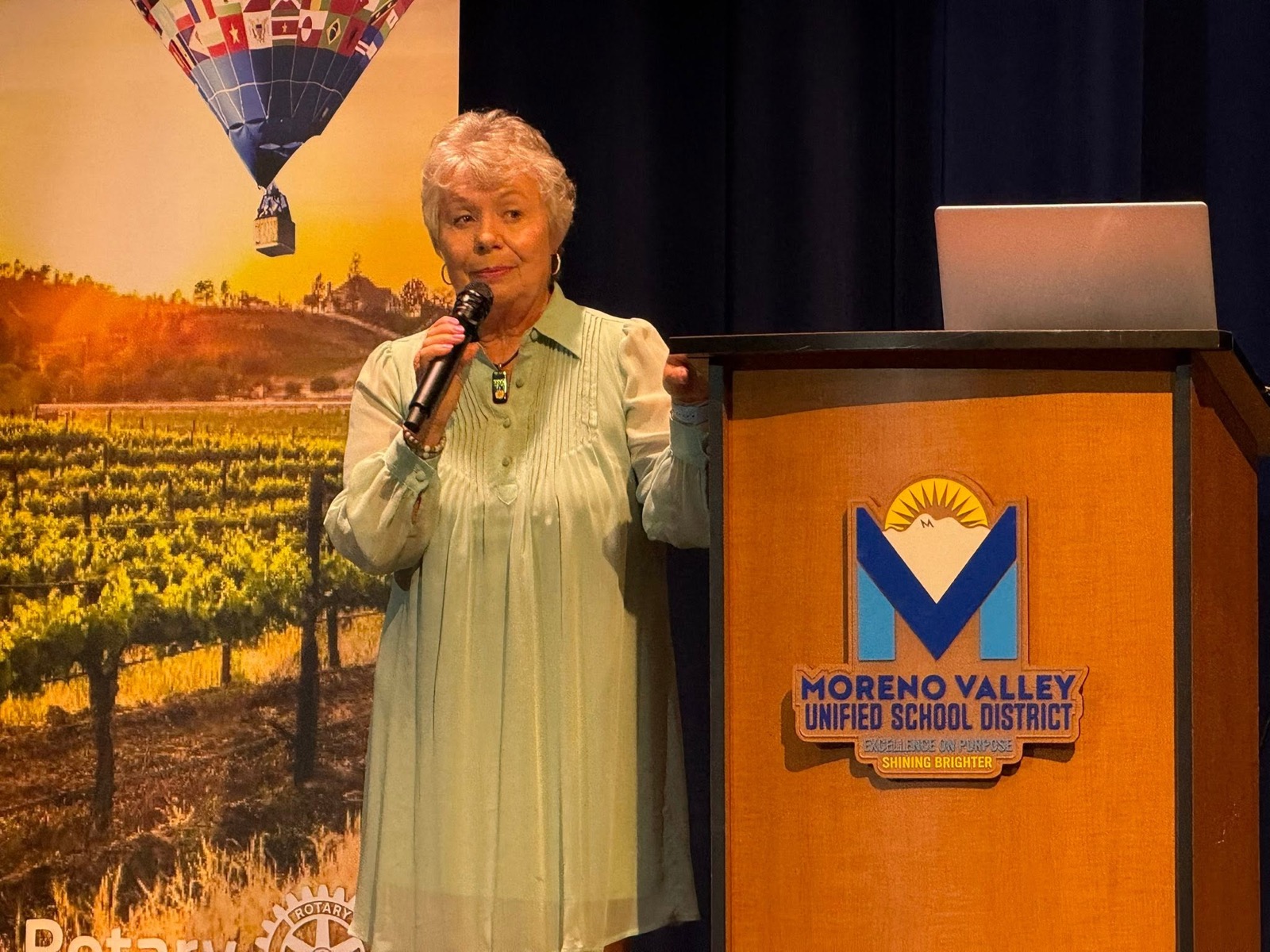 A speaker addresses the RYSE 2026 audience at Moreno Valley High School Performing Arts Center