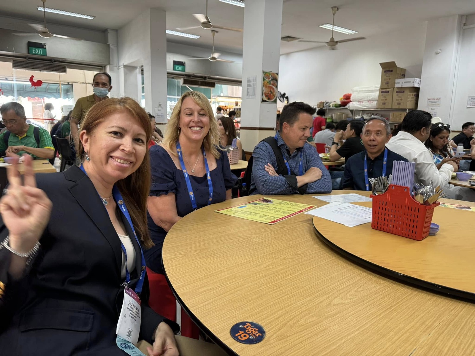 District 5330 members share a meal at a Singapore hawker centre during the convention