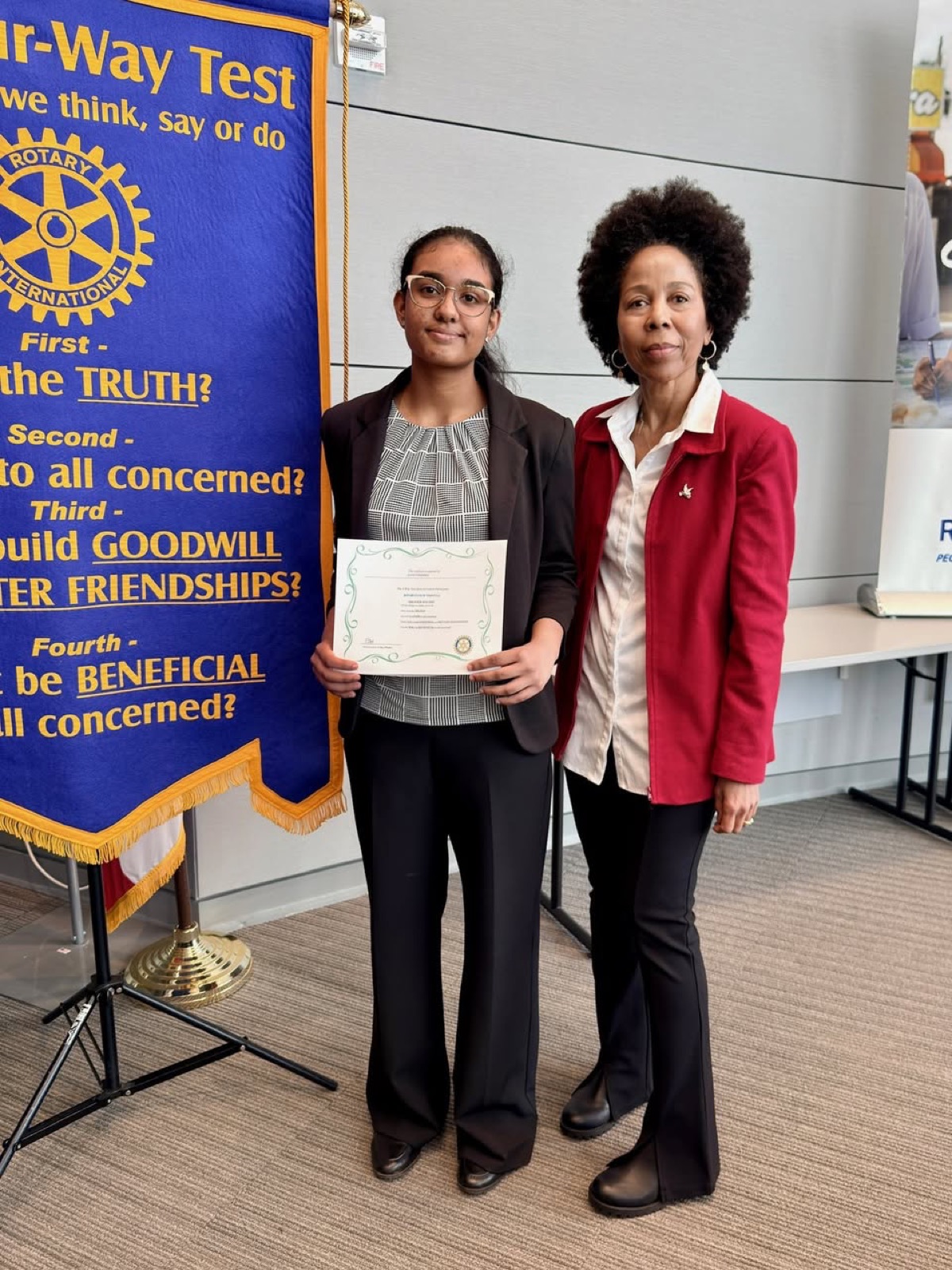 A contestant with her certificate