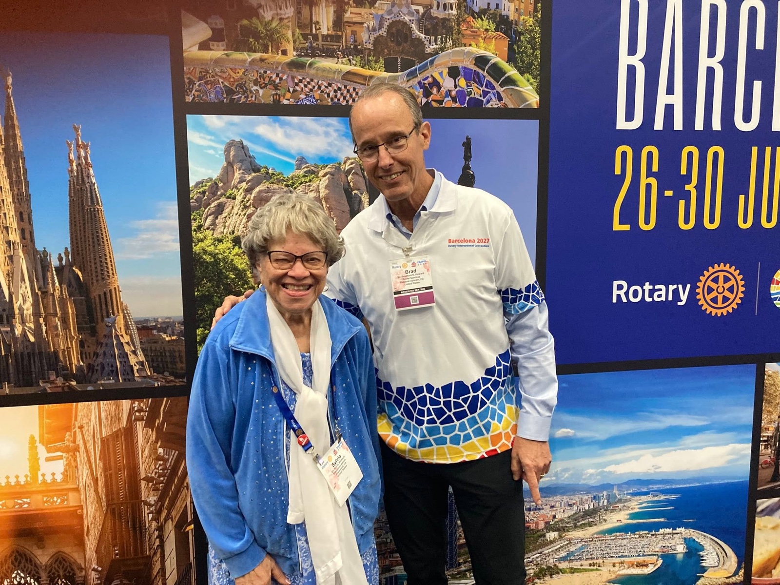 Past RI Director Brad Howard with Rotary icon Sylvia Whitlock at the Barcelona 2027 display