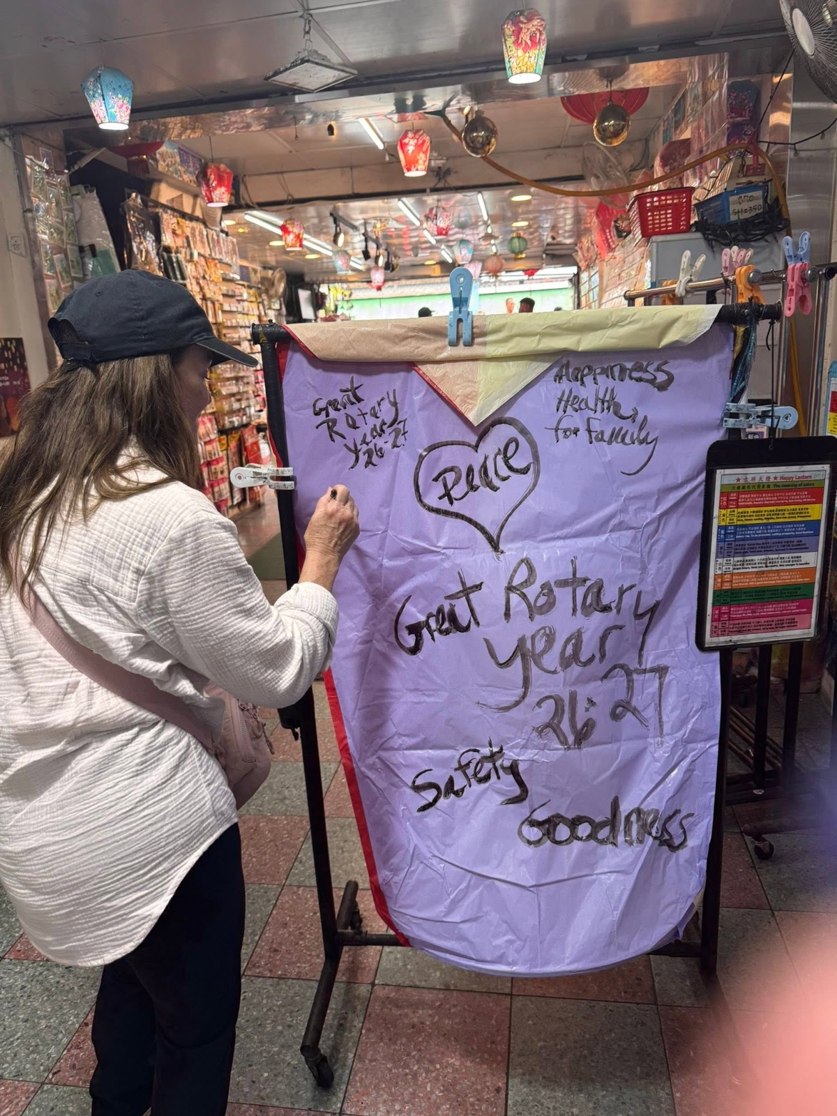 Writing District 5330's wishes on a sky lantern in Shifen